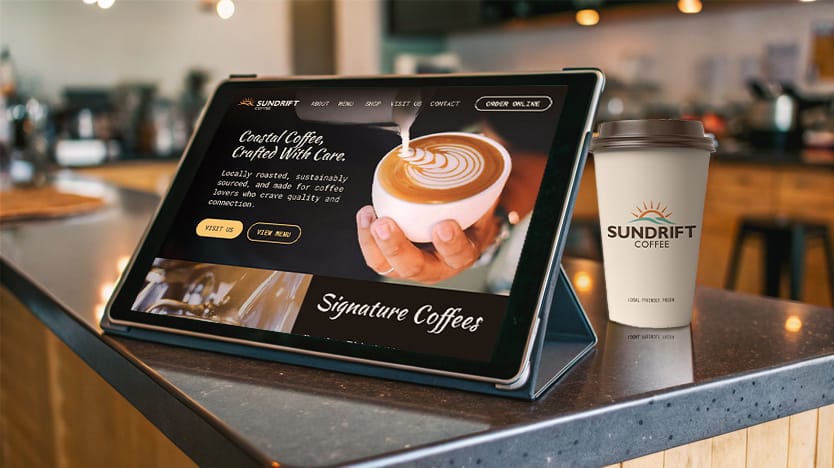 Small business website displayed on tablet next to branded coffee cup