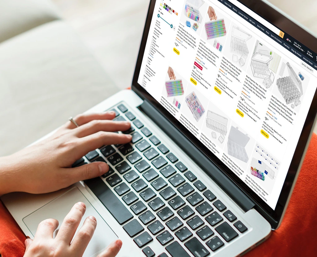 Person searching ecommerce store for storage organizers on laptop.